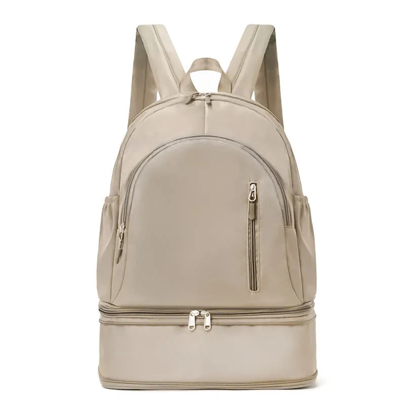 Women's casual backpack in black with adjustable curved shoulder straps and contrast stitching, 20-35L waterproof polyester.