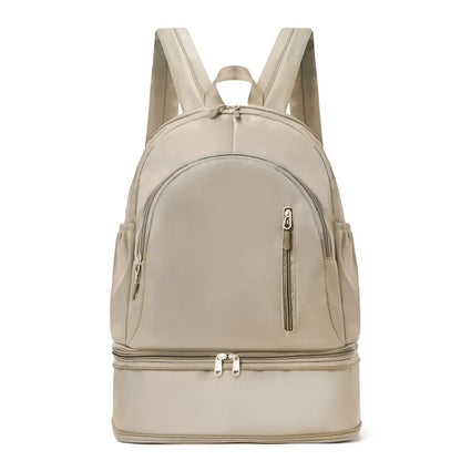Women's casual backpack in black with adjustable curved shoulder straps and contrast stitching, 20-35L waterproof polyester.