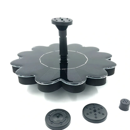 Black solar garden sprinkler with 160mm diameter panel showing adjustable 35-65cm spray height for plant watering