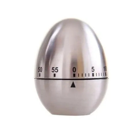 Stainless steel mechanical kitchen timer with egg-shaped design on kitchen counter