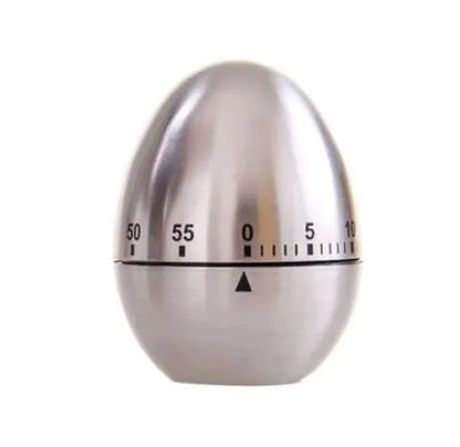 Stainless steel mechanical kitchen timer with egg-shaped design on kitchen counter