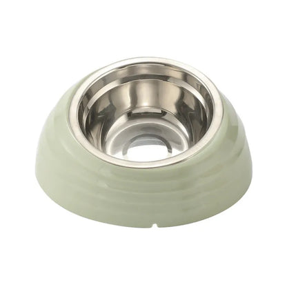 Single stainless steel cat bowl with a light green plastic base on a floor.