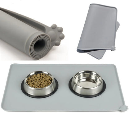 Silicone pet food mat with raised edges and non-slip base to contain messes and protect floors during pet mealtimes