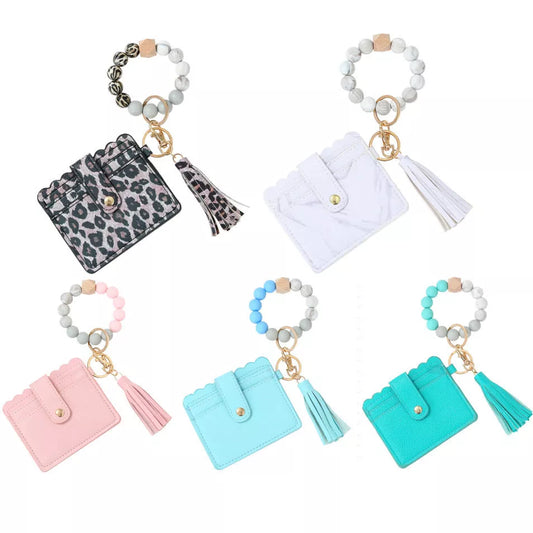 Women's silicone beads PU tassel bracelet keychain in marble, leopard print, pink, sky blue, and light green colors