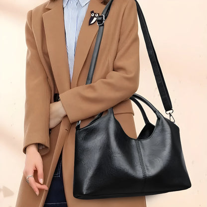Soft genuine leather women's crossbody bag in beige with large capacity and adjustable strap.