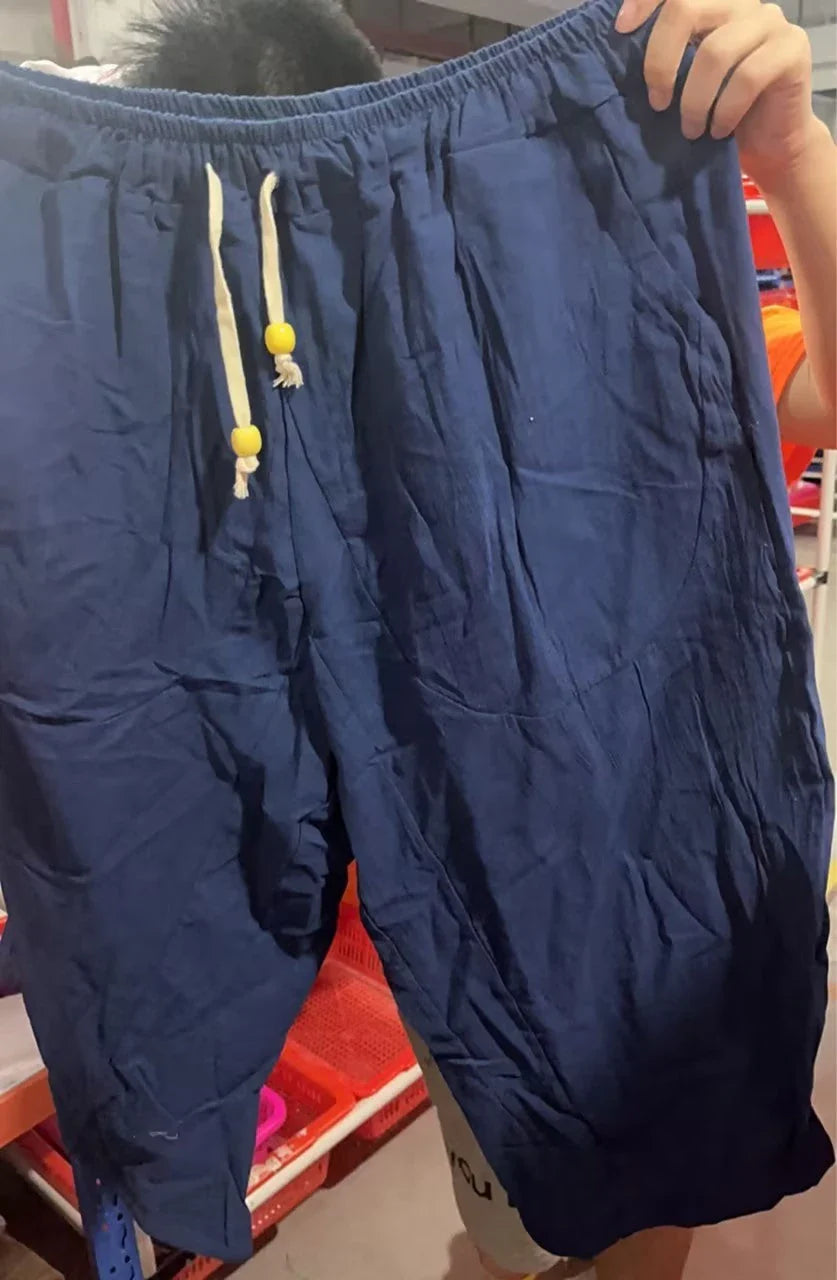 Comfy cotton harem pants in a variety of colors, featuring a relaxed, wide-leg silhouette and convenient drawstring waistband.