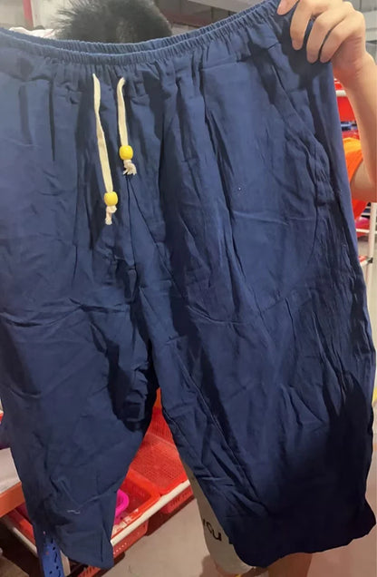 Comfy cotton harem pants in a variety of colors, featuring a relaxed, wide-leg silhouette and convenient drawstring waistband.