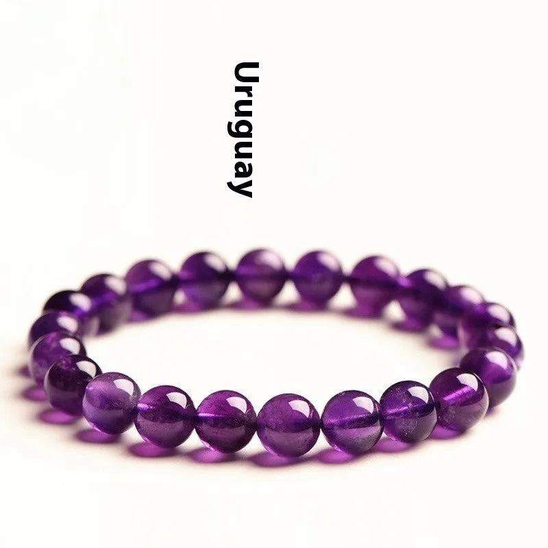 Natural amethyst scattered beads bracelet from Uruguay showing purple crystal beads in various sizes from 4mm to 16mm diameter