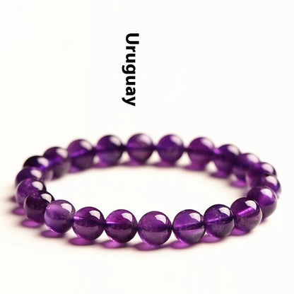 Natural amethyst scattered beads bracelet from Uruguay showing purple crystal beads in various sizes from 4mm to 16mm diameter
