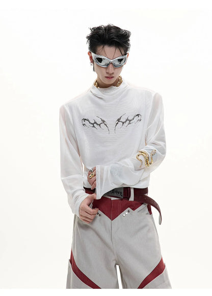 Man wearing a black slim-fit niche mesh long sleeve base layer shirt.