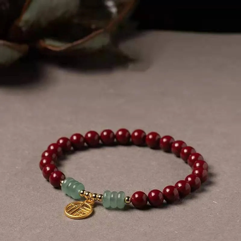 Women's fashion personalised gold cinnabar bracelet handmade from genuine cinnabar and copper beads in a wave shape national style bracelet available in brand cinnabar or pumpkin cinnabar colours as a unisex accessory