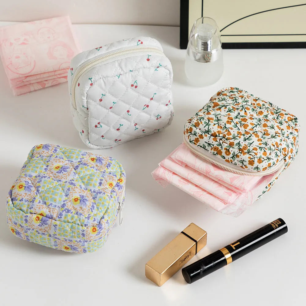 Women's key storage bag with floral patterns including cherry on white background design