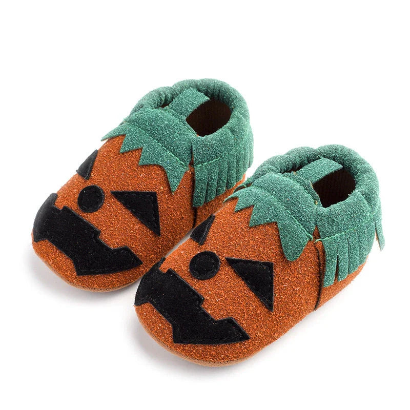 Adorable pumpkin-themed baby shoes with soft suede upper and non-slip canvas sole, available in vibrant yellow color and range of sizes