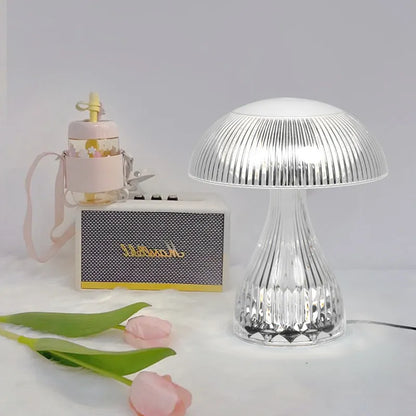 USB rechargeable acrylic table lamp with three colour changing modes on a surface.