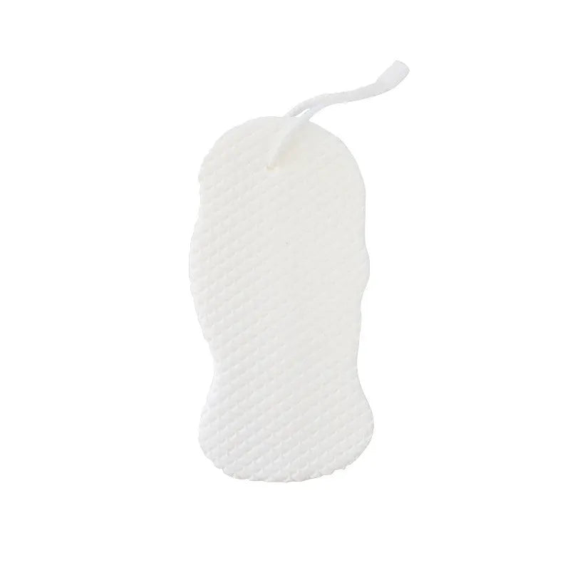 White 3D bath ball sponge with a fish scale exfoliating texture on a blue background.
