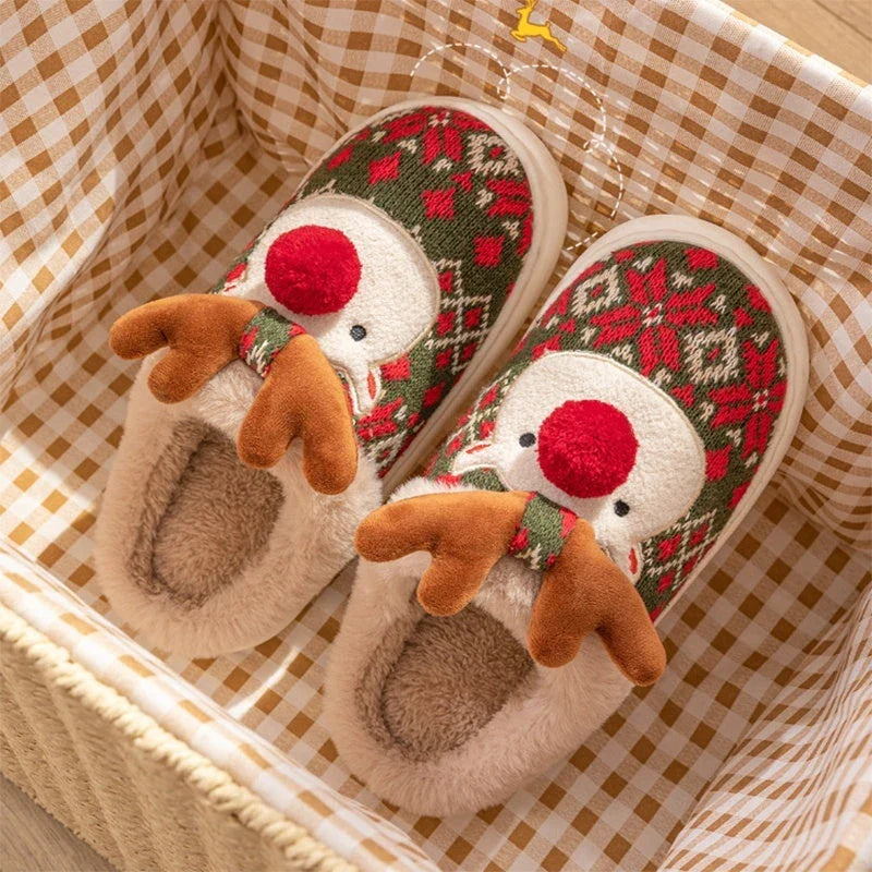 Cozy elk-inspired plush slippers in festive Christmas green and red colors, featuring a soft, comfortable upper and non-slip soles for indoor wear