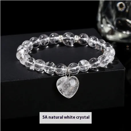 Handmade women's bracelet with natural gemstone beads and a silver love pendant charm.