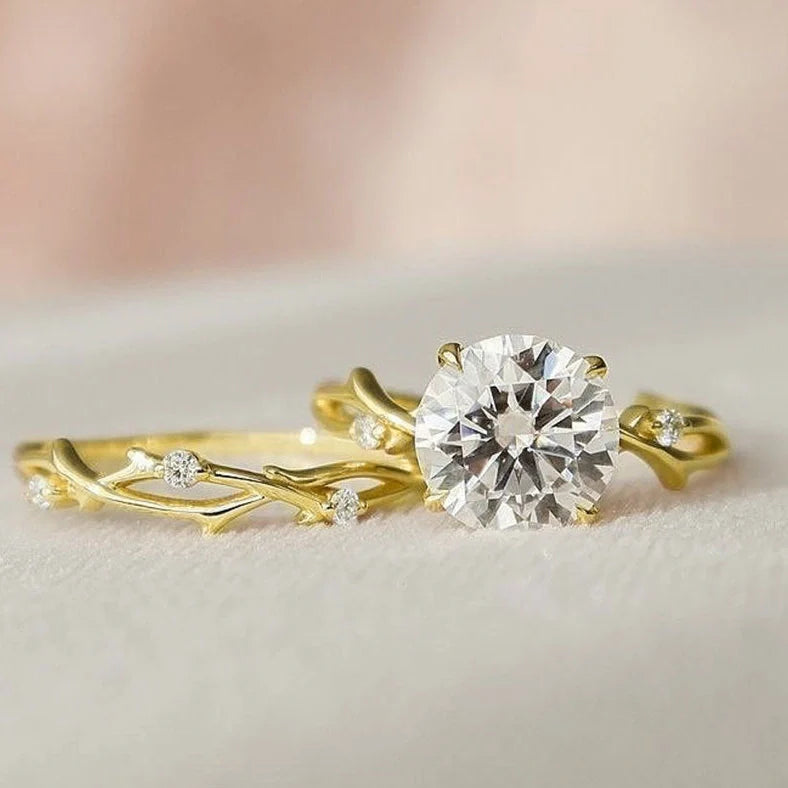 Geometric design rose gold plated couple rings with simulation diamond centrepiece showing faceted edges