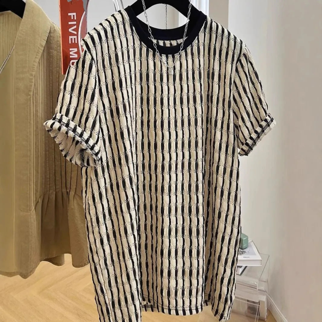 Black and white striped men's loose-fit short sleeve pullover on a hanger
