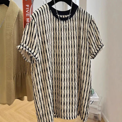 Black and white striped men's loose-fit short sleeve pullover on a hanger