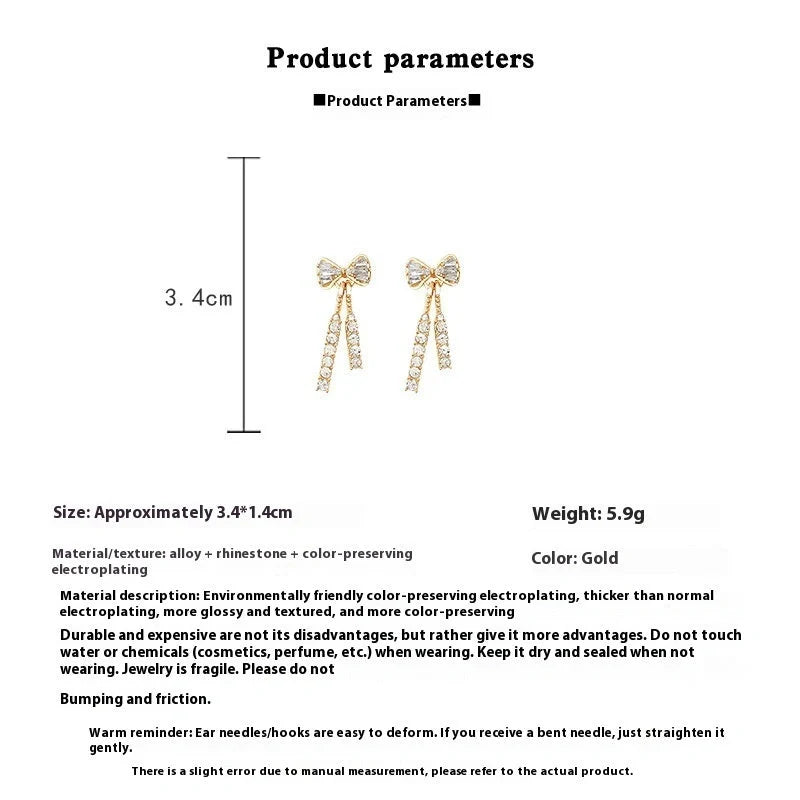 Gold bow-shaped earrings with crystal embellishments, lightweight and elegant