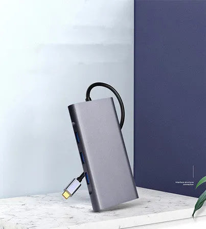 10-in-1 Apple MacBook docking hub with power bank functionality showing multiple USB ports