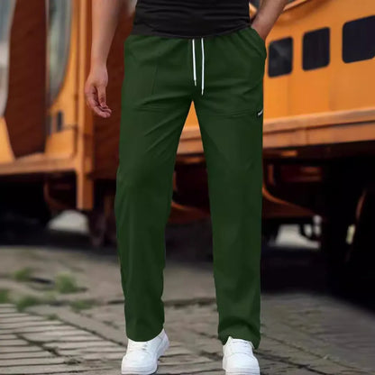 Men's polyester trousers for spring and autumn in light grey, shown in a casual setting