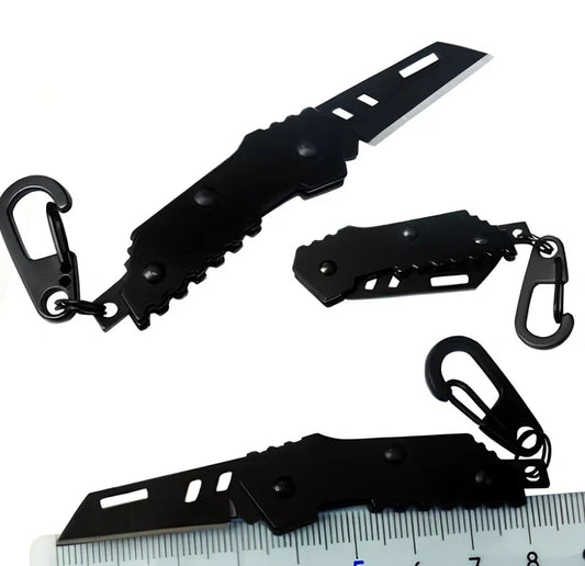 Black pocket folding knife with serrated blade, 85mm length, stainless steel handle