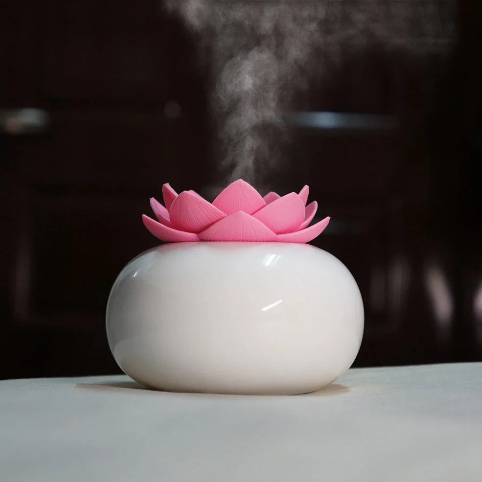 Lotus-shaped aromatherapy humidifier with ceramic base showing green and white colour option