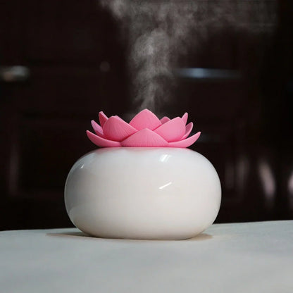 Lotus-shaped aromatherapy humidifier with ceramic base showing green and white colour option
