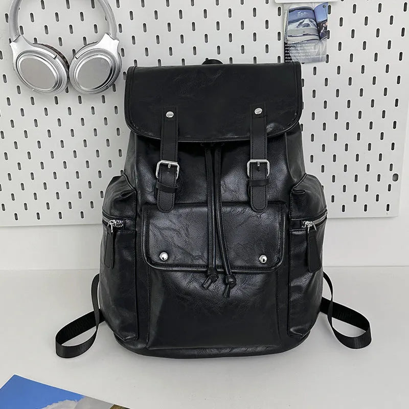Large capacity PU travel backpack in black or brown with waterproof function and curved shoulder strap