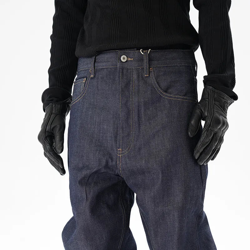 Man wearing dark blue loose-fit straight-leg denim jeans, showcasing the casual relaxed silhouette.