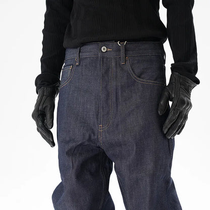 Man wearing dark blue loose-fit straight-leg denim jeans, showcasing the casual relaxed silhouette.