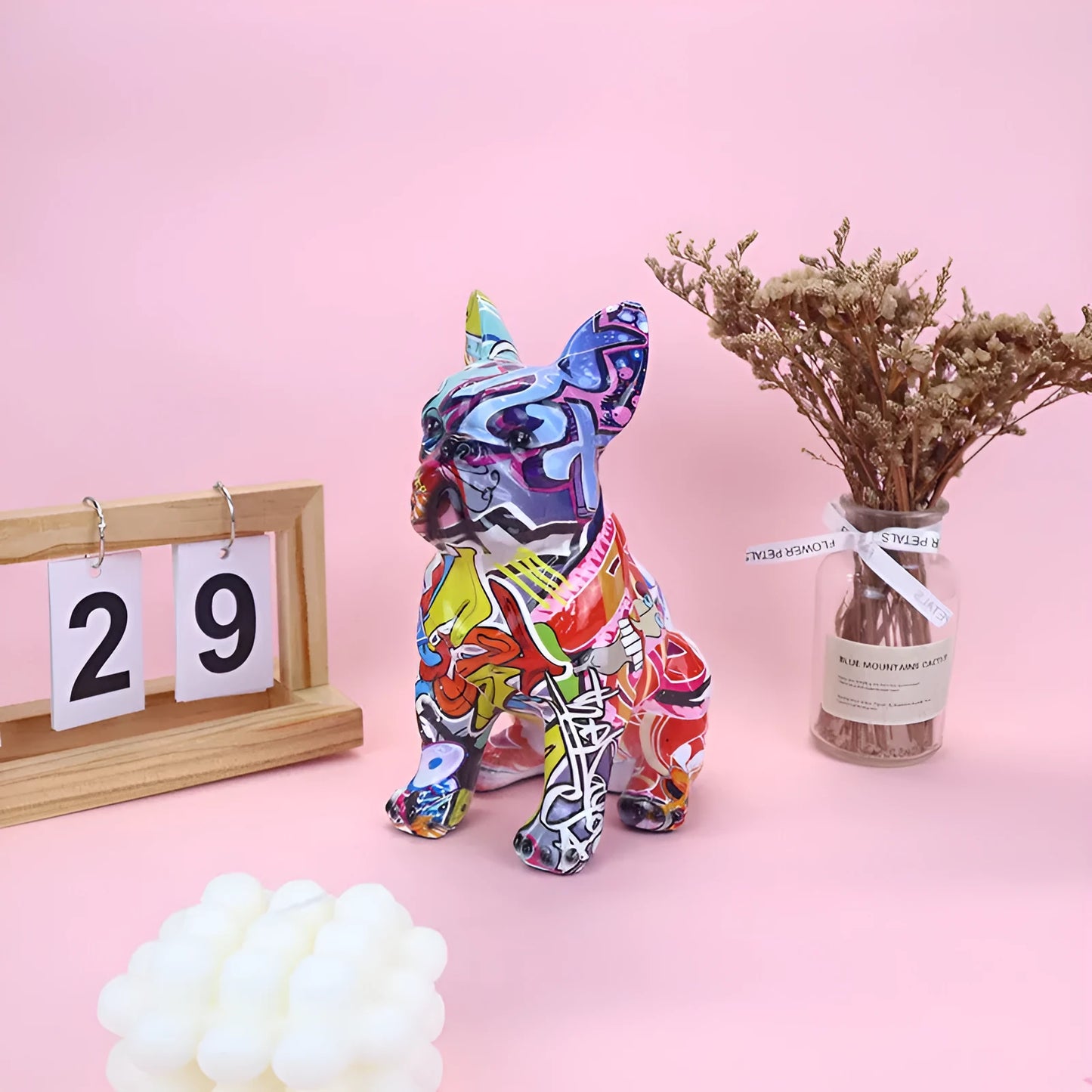 Modern graffiti-coloured resin bulldog statue on a white background.