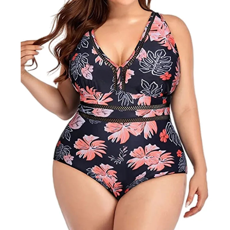 Black plus-size bikini swimsuit with print design and mesh fabric, shown on a hanger.