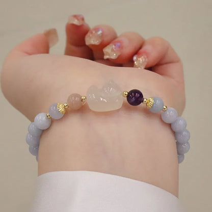 Gold plated women's bracelet with artificial crystal aquamarine chalcedony pendant in climbing cat design