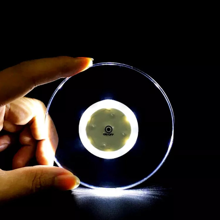 LED Glow Coaster with vibrant colors illuminating a cocktail glass