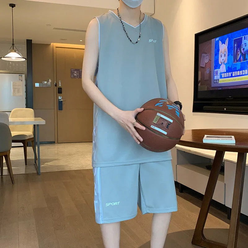 Men's thin polyester basketball sports suit consisting of a sleeveless vest and short pants on a hanger.