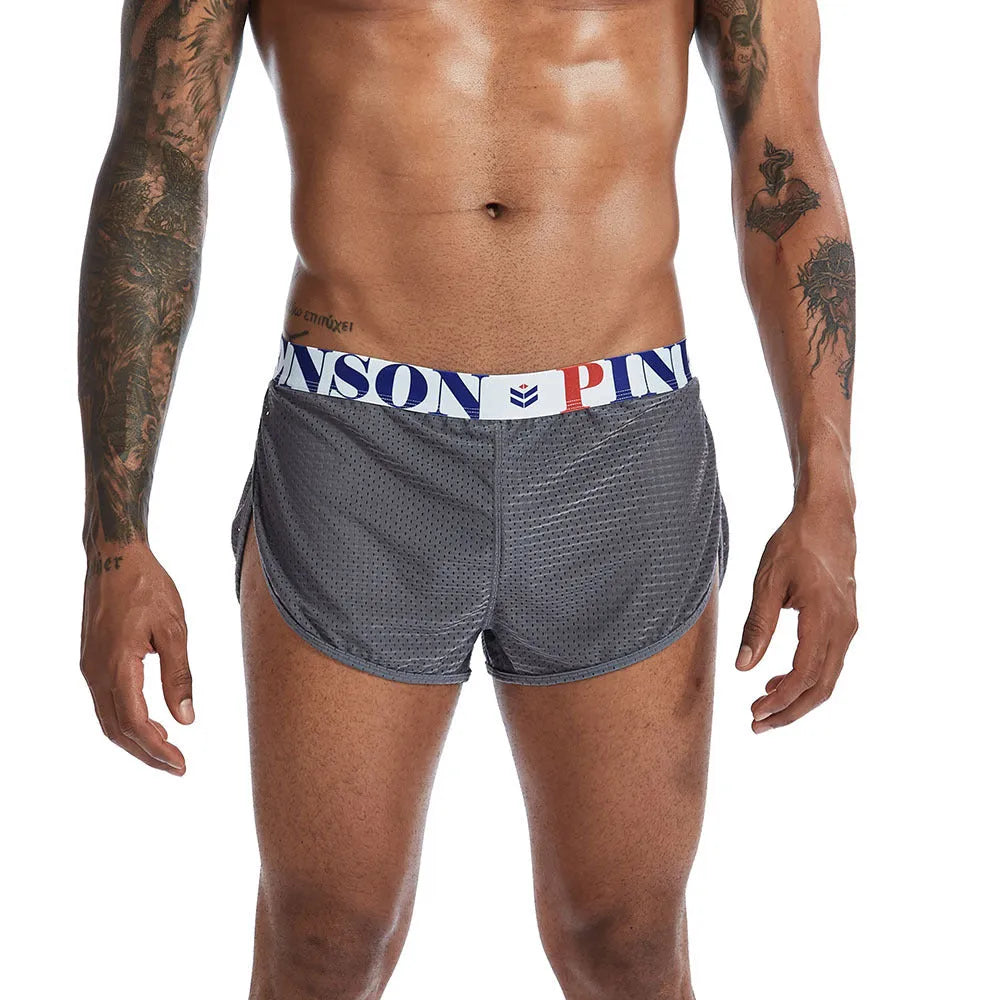 Breathable mesh men's boxer briefs in black, shown laid flat