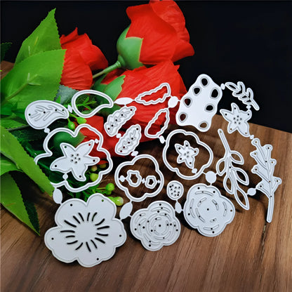 Silver carbon steel flower paper cutting mould measuring 14.3 by 9.9 cm with etched plant design