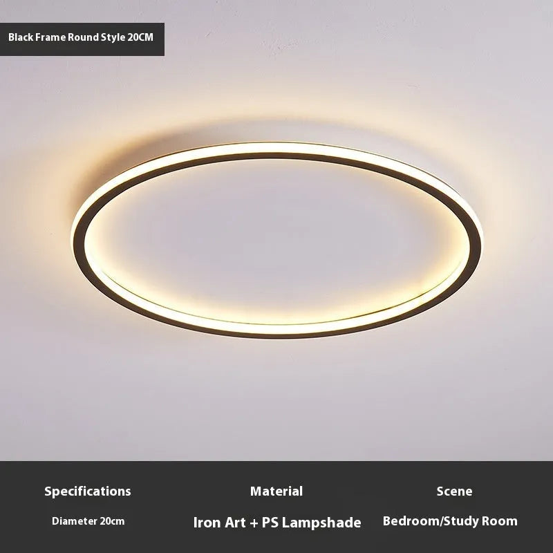 Minimalist circular ceiling lamp in gold finish mounted on a white ceiling