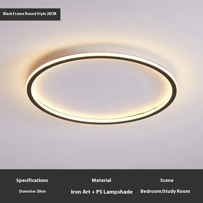 Minimalist circular ceiling lamp in gold finish mounted on a white ceiling