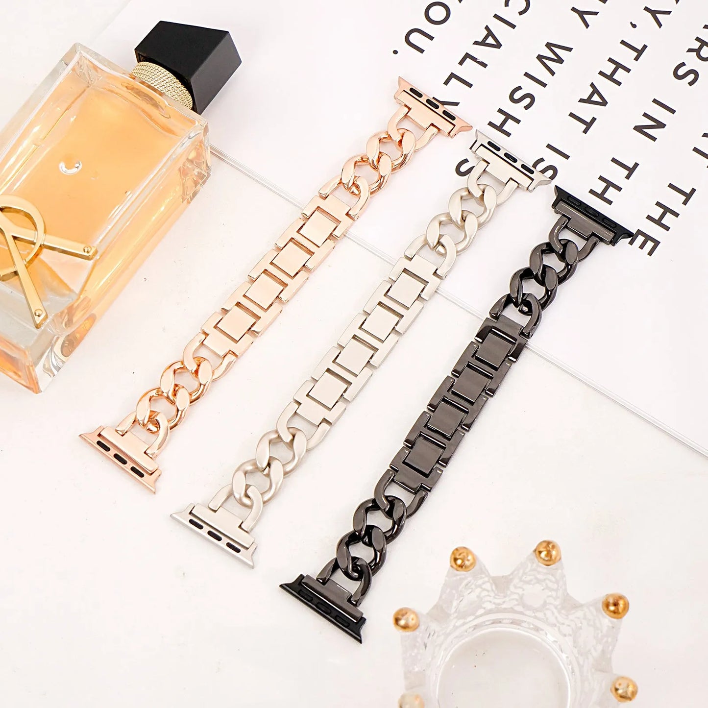 Silver metal link watch strap for Apple Watch with 22mm connectors on a grey background