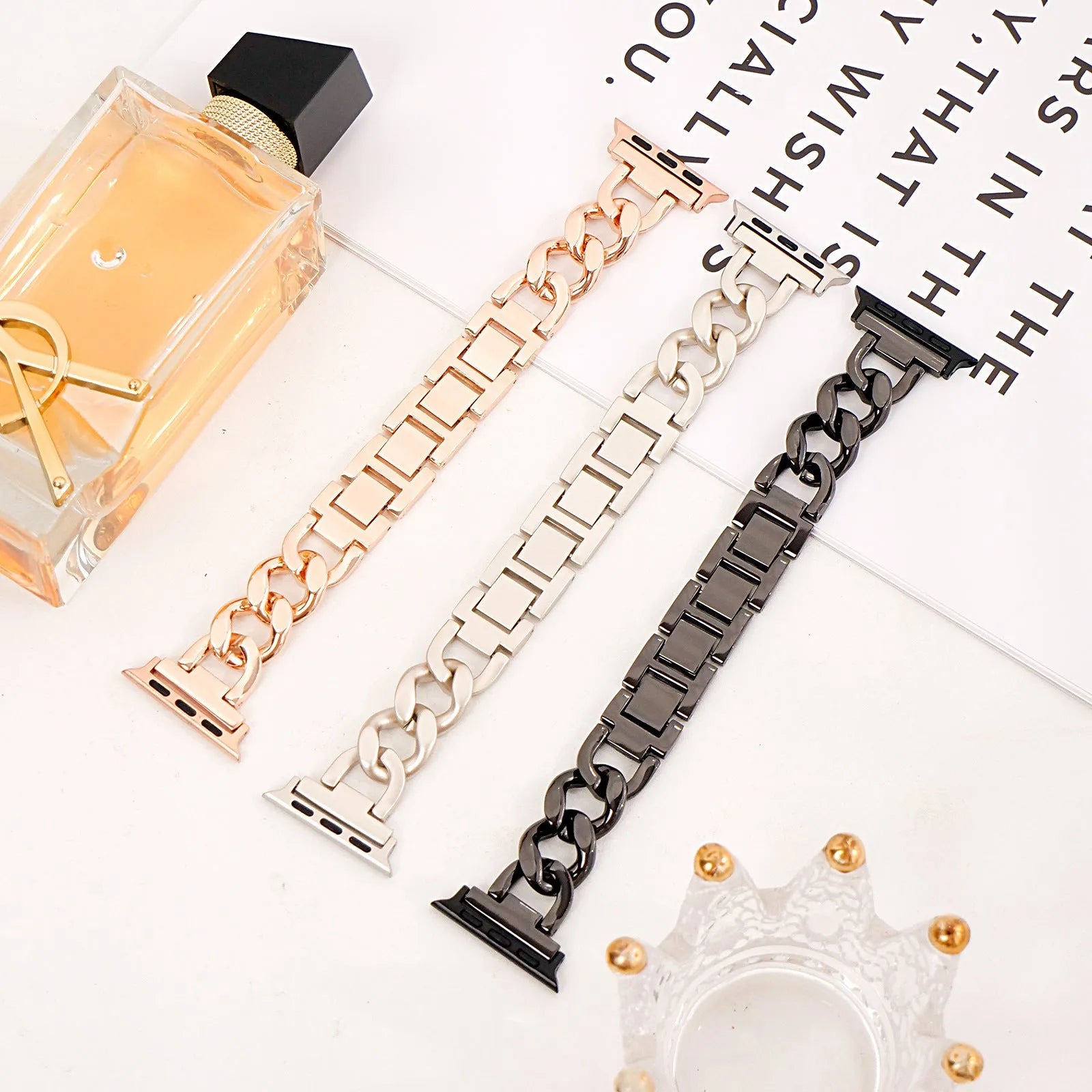 Silver metal link watch strap for Apple Watch with 22mm connectors on a grey background