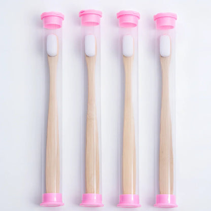 Bamboo toothbrush with wood colour handle measuring 18.5cm long with soft white bristles in protective tube