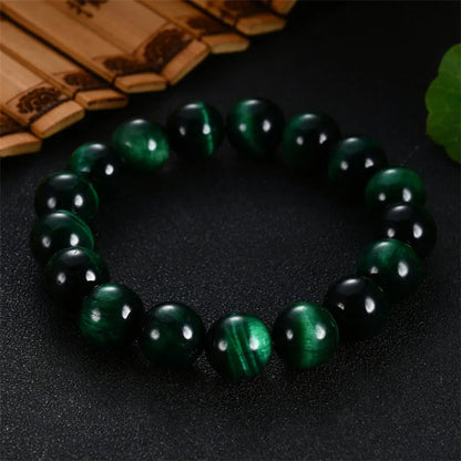Green Tiger Eye stone bracelet with geometric beads, showing size options.