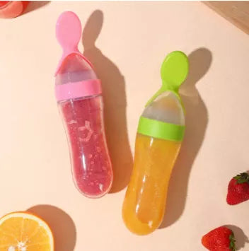 Silicone baby rice paste spoon feeding bottle with suction cup in blue, green, pink, yellow, and white
