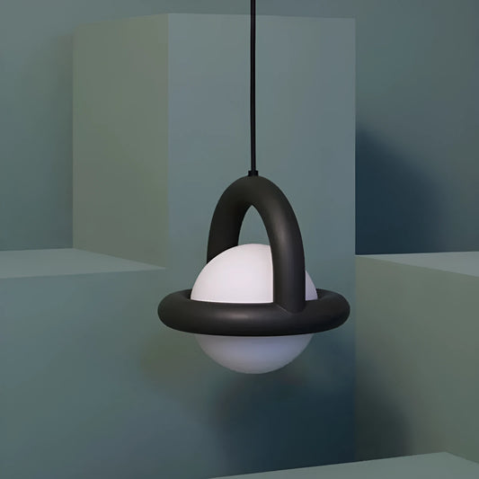 Danish designer hanging line lamp with adjustable cord and matte finish in bedside setting