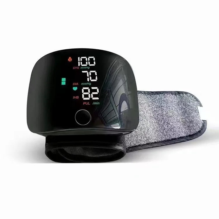 Black wrist sphygmomanometer with USB rechargeable battery and multilingual voice options for blood pressure monitoring