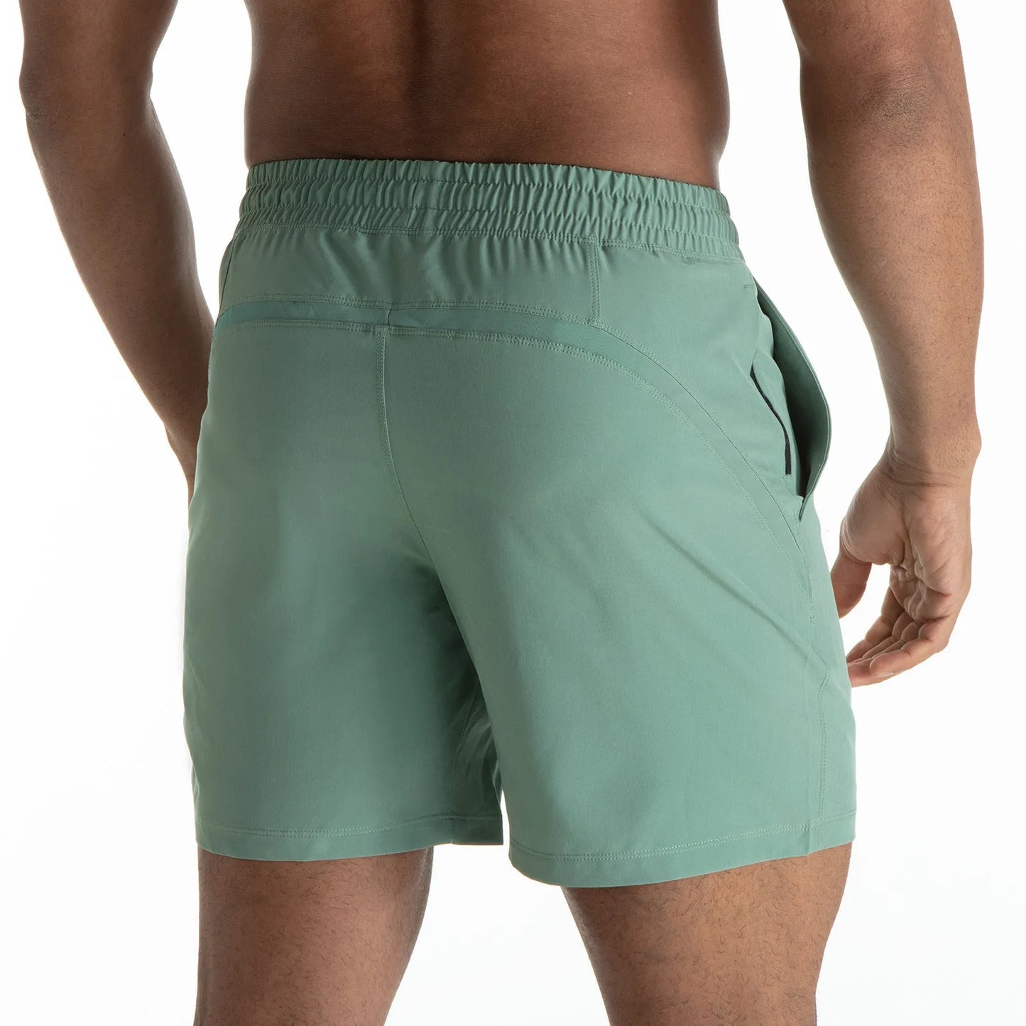 Man wearing black quick-dry polyester sports shorts suitable for running or gym workouts.